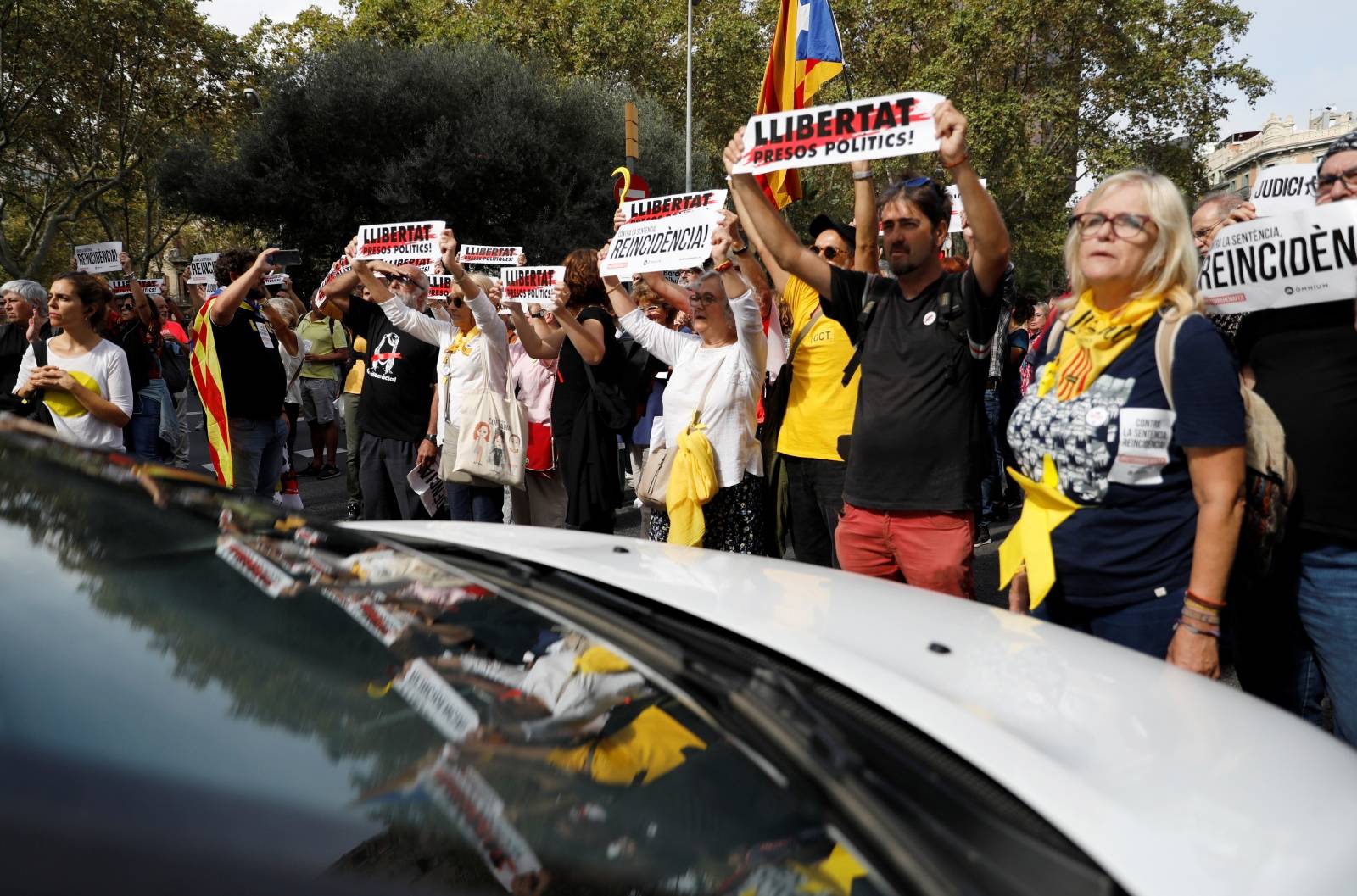 Demonstrators block a street next to Plaza de Catalunya during a protest after a verdict in a trial over a banned independence referendum, in Barcelon