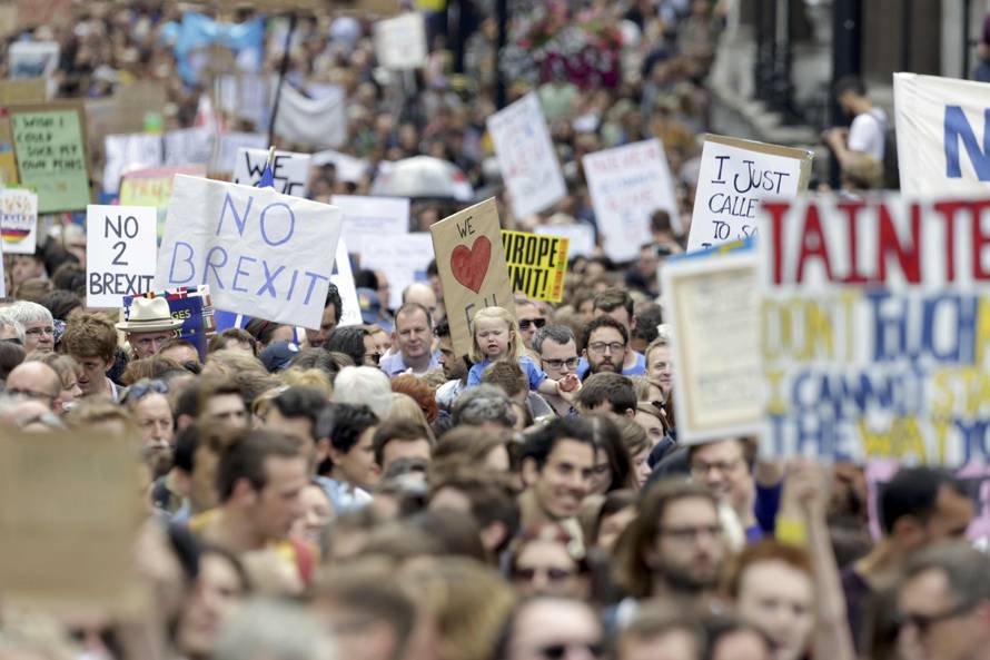 People hold banners during a demonstration against Britain's decision to leave the European Union, in central London