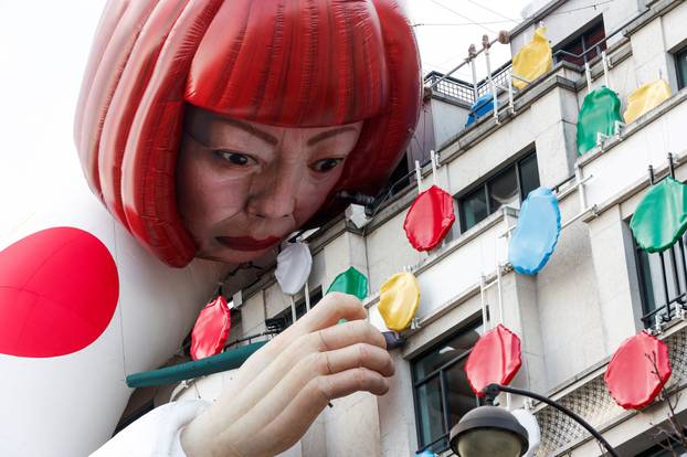 FILE PHOTO: Installation of Yayoi Kusama's mannequin covers the exterior of the Louis Vuitton's flagship store in Paris