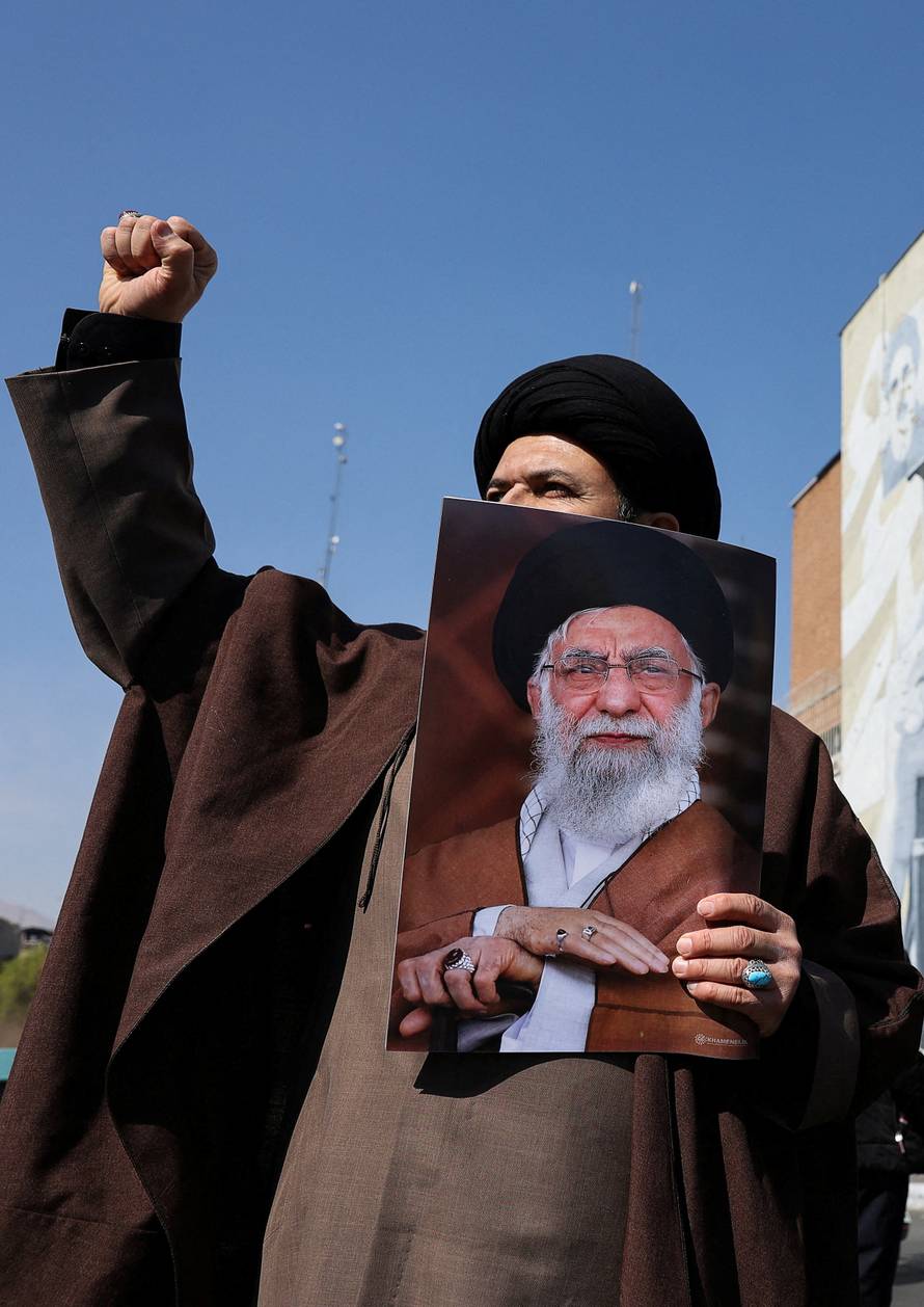 FILE PHOTO: People attend an anti-Israeli and U.S rally in Tehran
