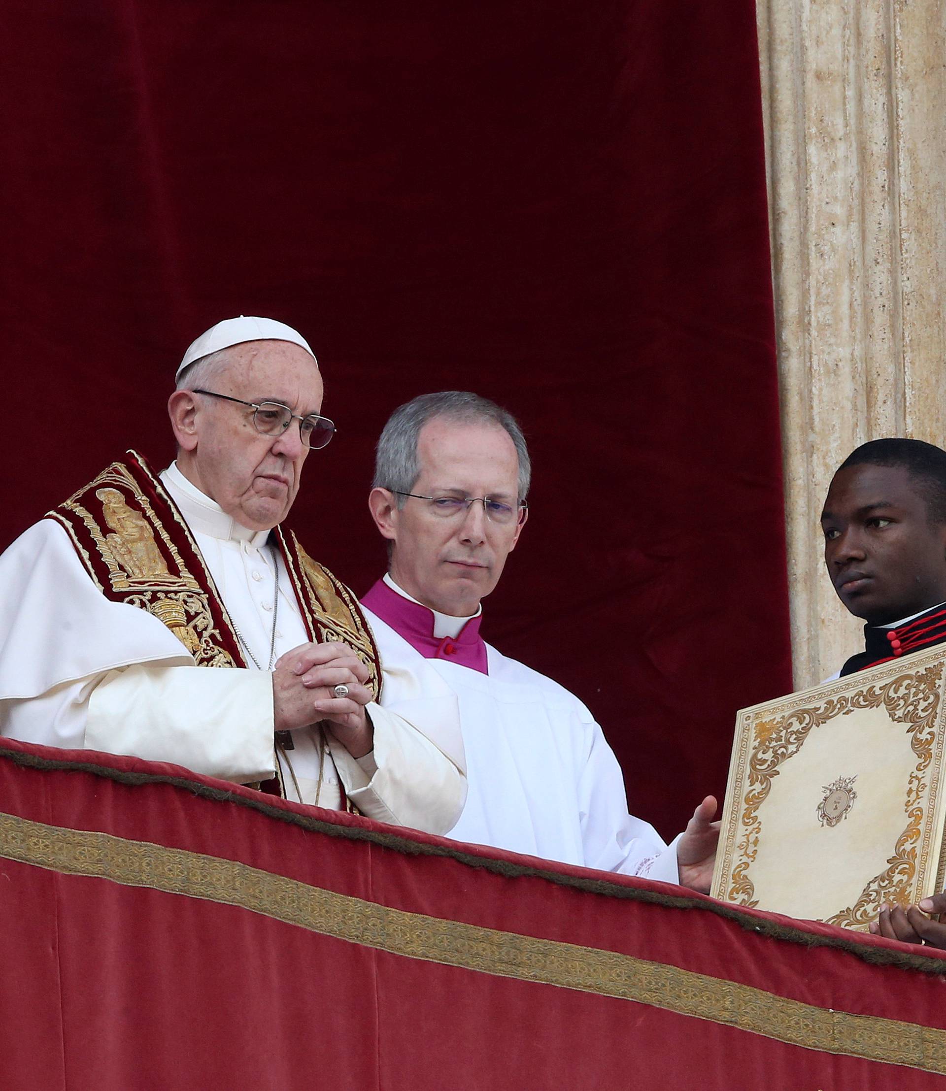 Pope Francis arrives to leads "Urbi et Orbi" (to the city and the world) message from the balcony overlooking St. Peter's Square at the Vatican