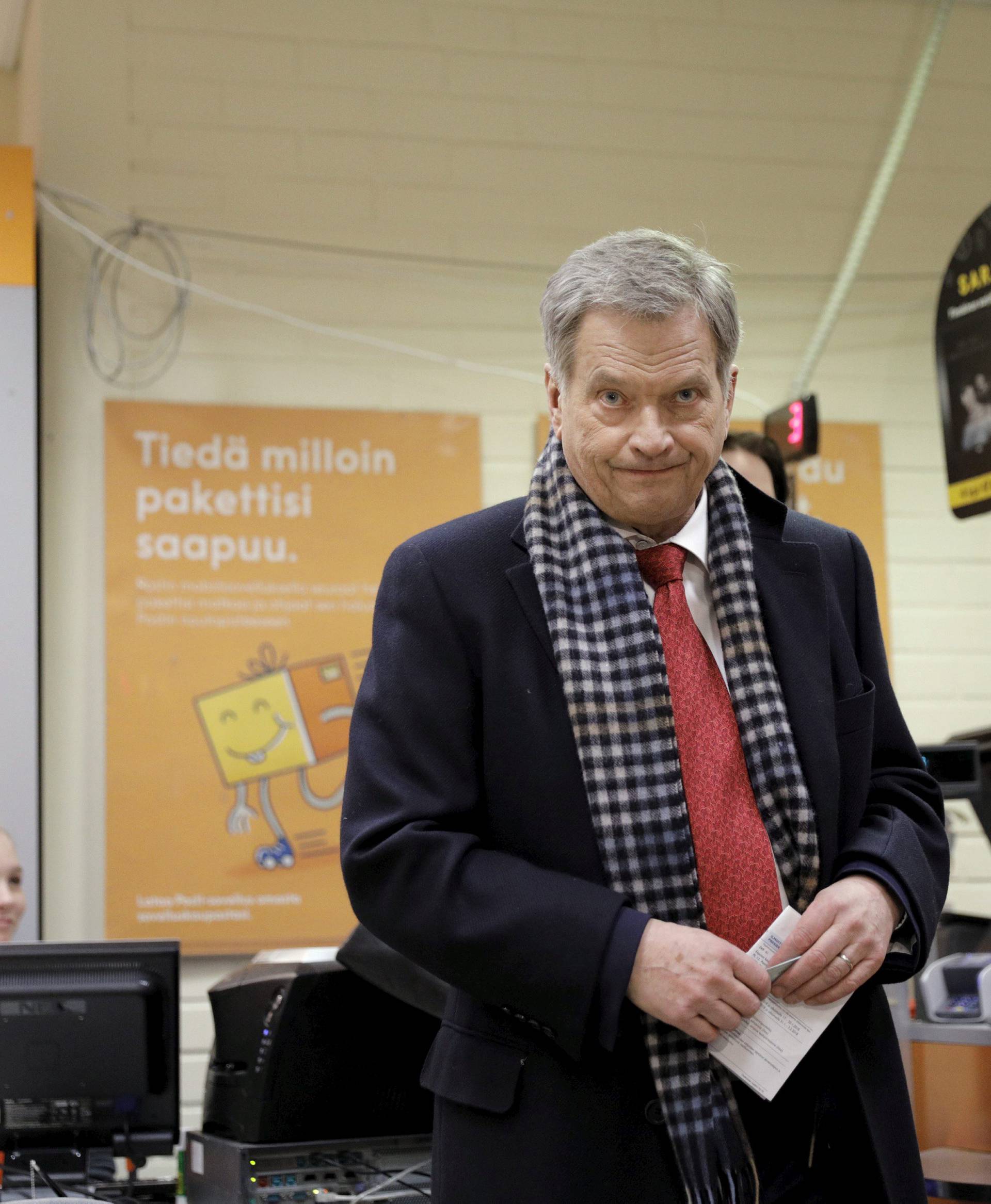 Acting President of Finland and candidate for presidential election, Sauli Niinisto casts his vote in advance voting in Helsinki