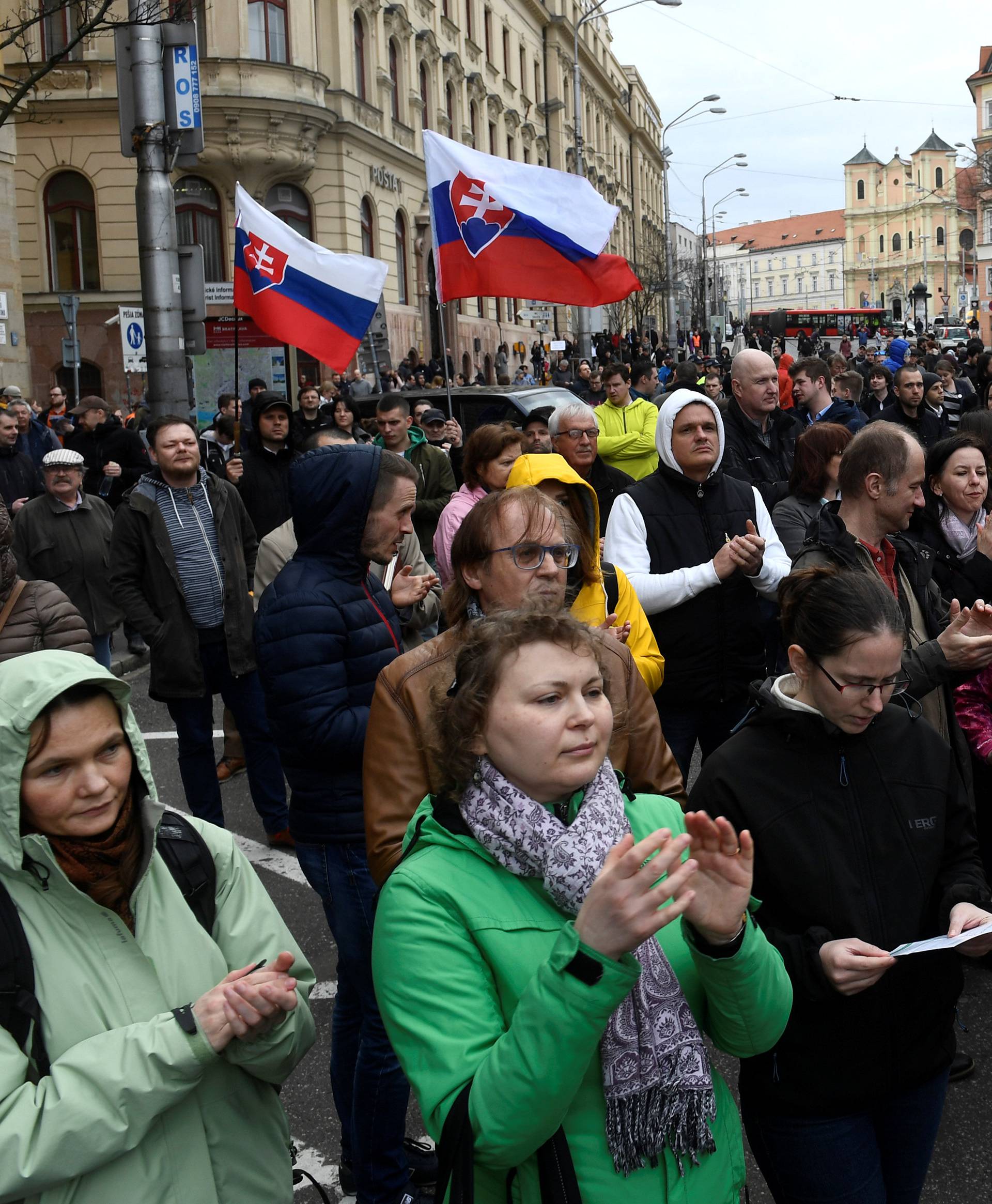 People attend a protest rally in reaction to the murder of Slovak investigative reporter Jan Kuciak and his fiancee Martina Kusnirova, in Bratislava