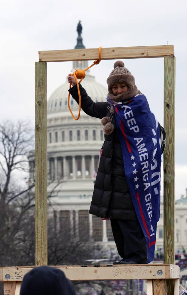 A supporter of U.S. President Donald Trump holds a noose outside the U.S. Capitol Building in Washington