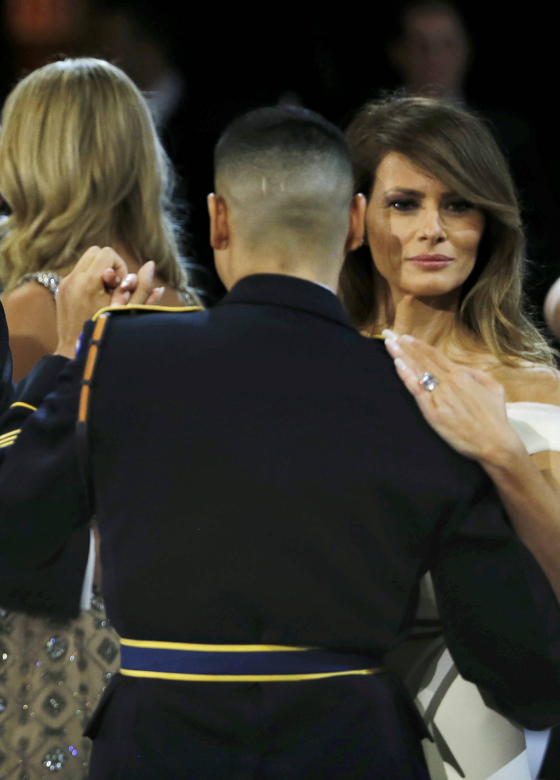 U.S. Navy Petty Officer Second Class Catherine Cartmell dances with President Trump as United States Army Staff Sergeant Jose A. Medina dances with First Lady Melania Trump during the Salute to Our Armed Services Ball in Washington
