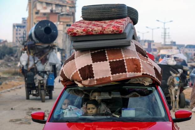 Displaced Palestinians wait to be allowed to return to their homes in northern Gaza, in the central Gaza Strip