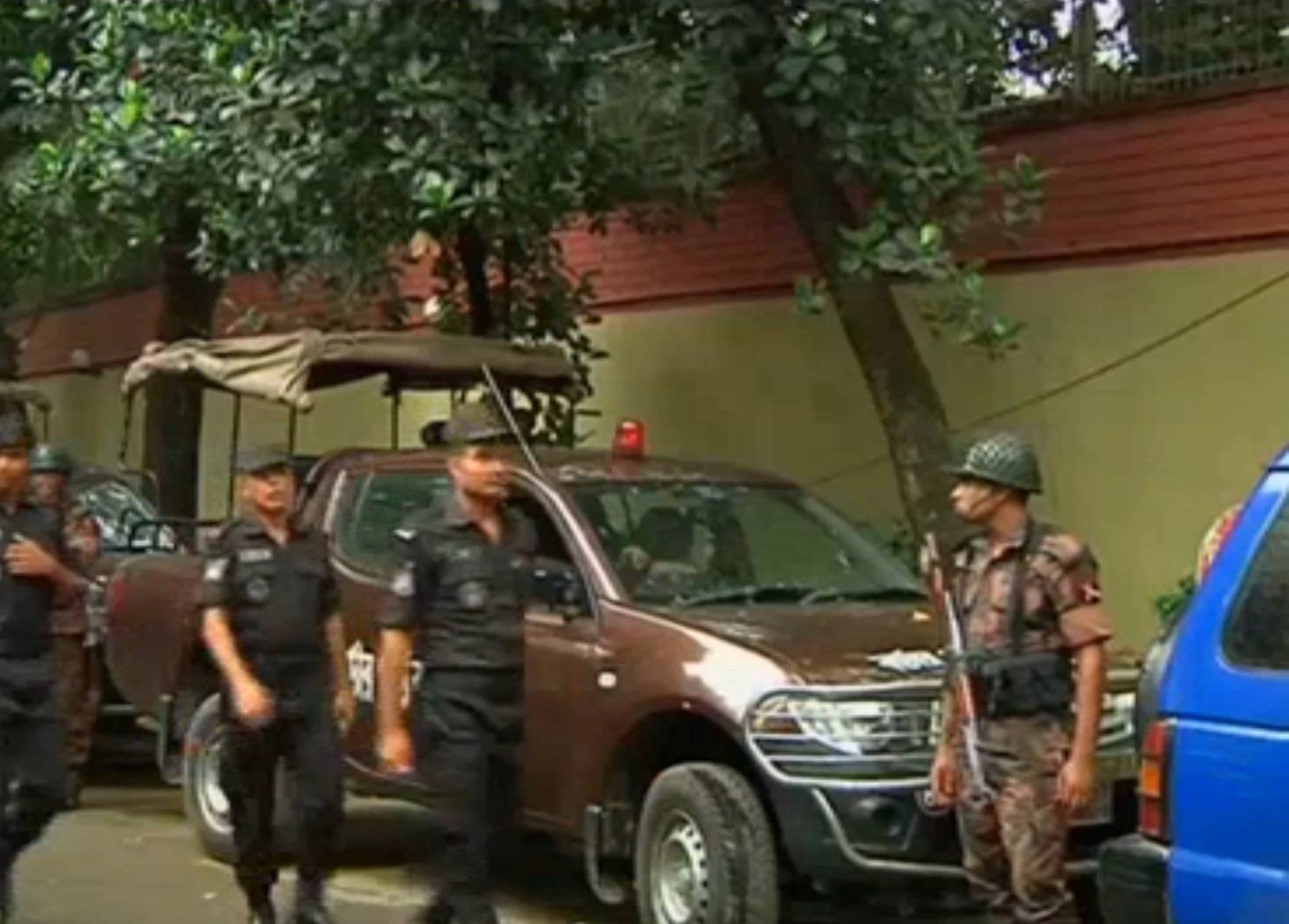 Still frame taken from video shows Rapid Action Battalion members walking as police stormed the Holey Artisan restaurant after gunmen attacked it and took hostages early on Saturday in Dhaka