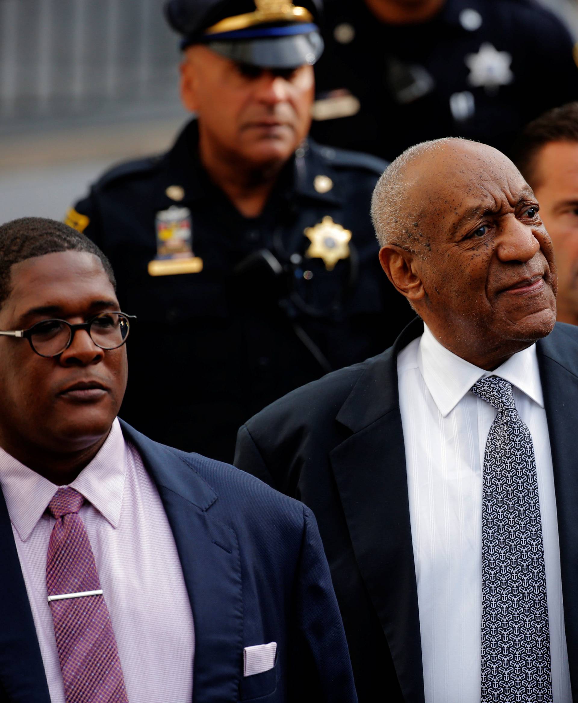Actor and comedian Bill Cosby departs with comedian Joe Torry and publicist Andrew Wyatt after the fourth day of Cosby's sexual assault trial at the Montgomery County Courthouse in Norristown, Pennsylvania