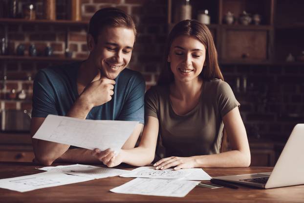 Handsome Girl and Guy Working Home with Laptop
