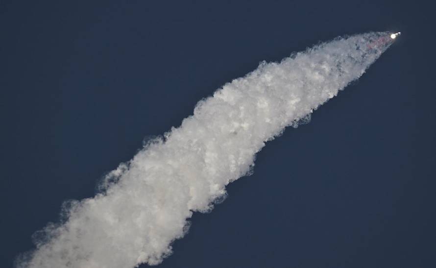 A SpaceX Super Heavy booster carrying the Starship spacecraft lifts off on its 10th test flight