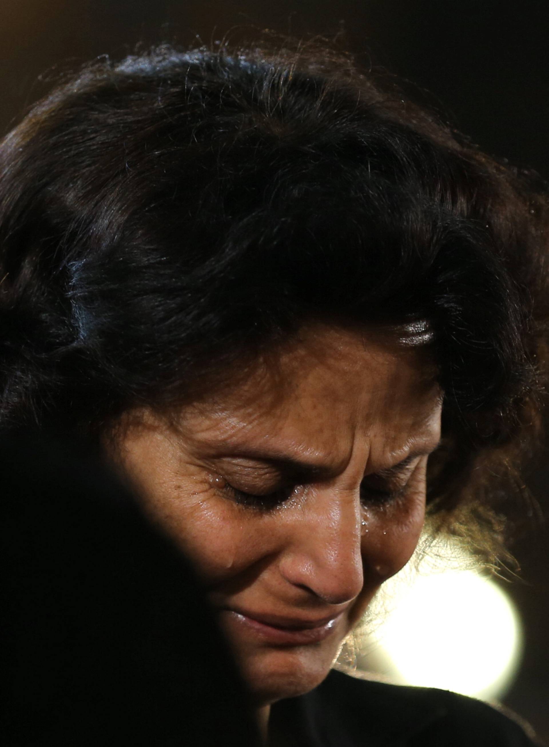 Relatives of the Christian victims of the crashed EgyptAir flight MS804 react and cry during an absentee funeral mass at the main Cathedral in Cairo