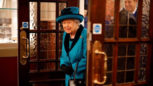 Britain's Queen Elizabeth visits the Royal Philatelic Society in London