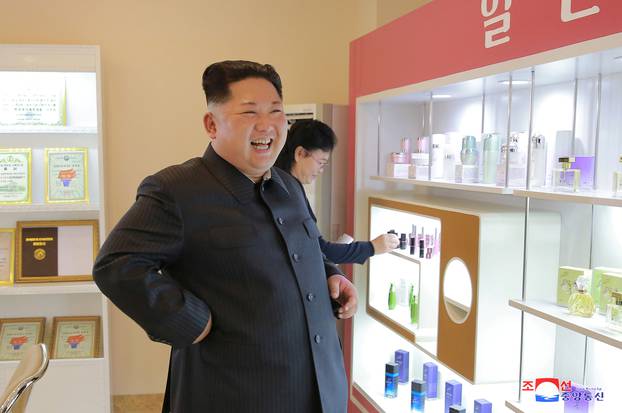 North Korean leader Kim Jong Un visits a cosmetics factory in this undated photo released by North Korea