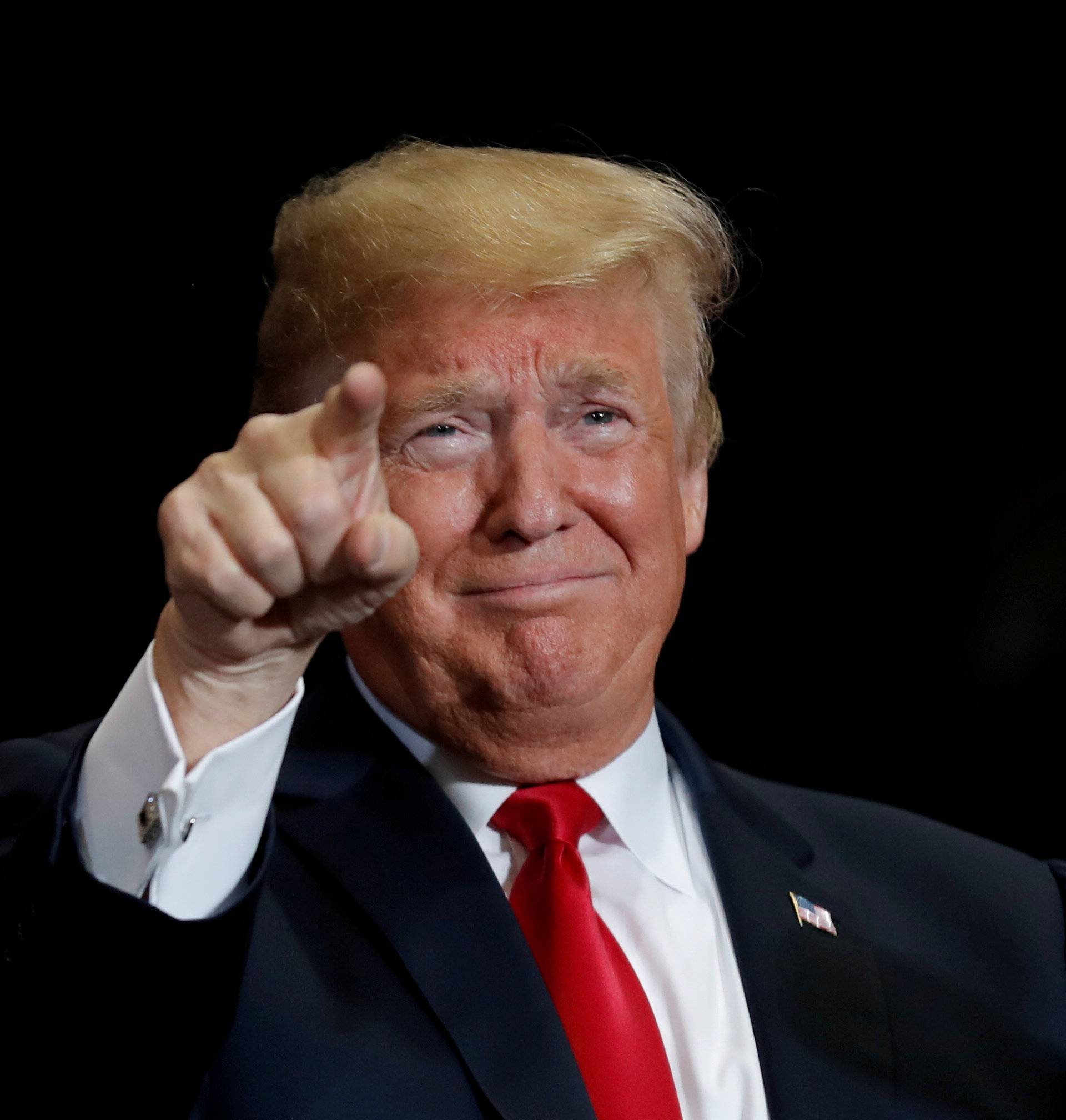 FILE PHOTO:    U.S. President Donald Trump acknowledges supporters at a campaign rally at the Show Me Center in Cape Girardeau Missouri