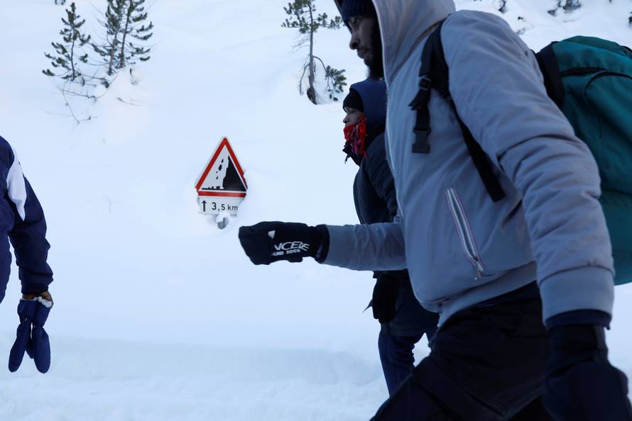 The Wider Image: Migrants risk death crossing Alps to reach France