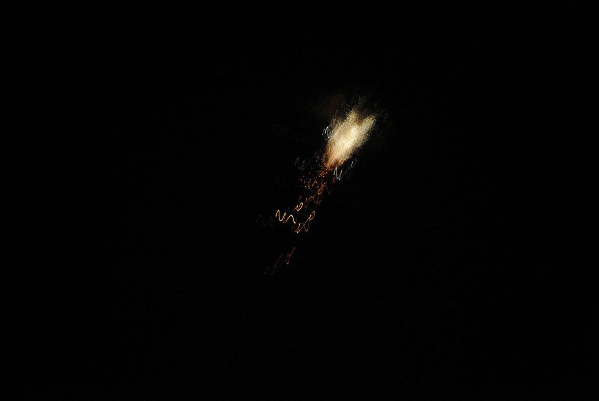 An exploded missile is seen over Damascus