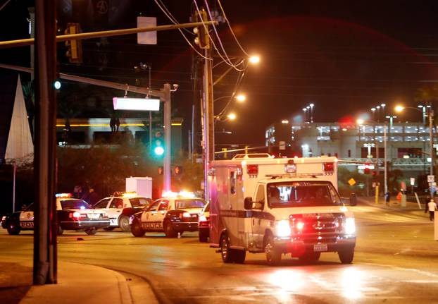 An ambulance leaves the concert venue after a mass shooting at a music festival on the Las Vegas Strip in Las Vegas