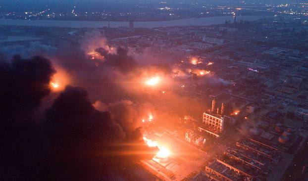 Smoke billows from fire following an explosion at the pesticide plant owned by Tianjiayi Chemical, in Xiangshui