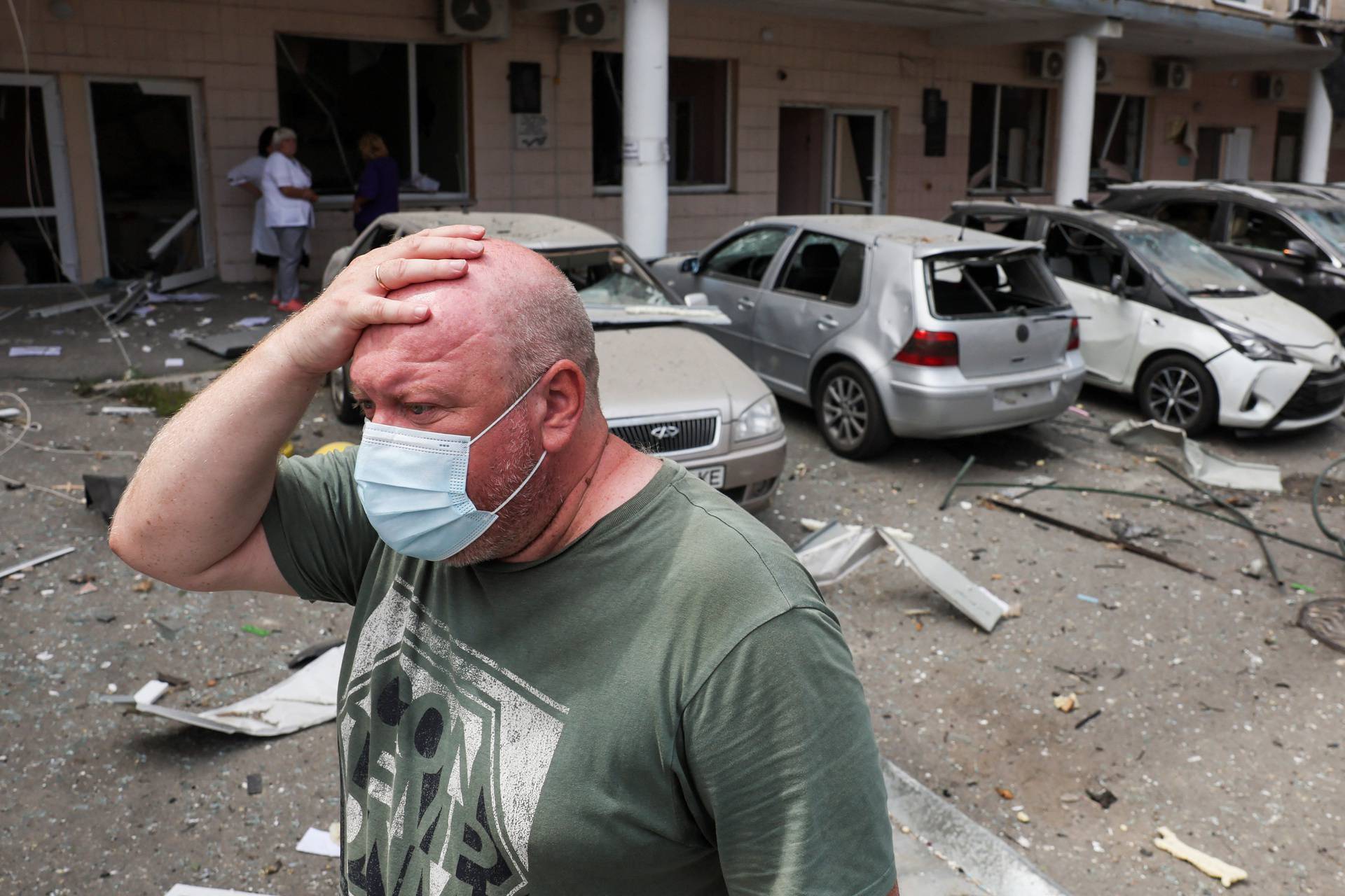 A man reacts near Ohmatdyt Children's Hospital that was damaged during a Russian missile strikes, in Kyiv