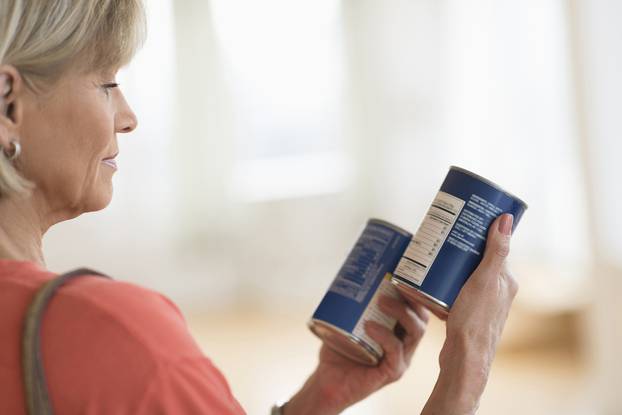 Cropped,Image,Of,Woman,Comparing,Products,In,Shop