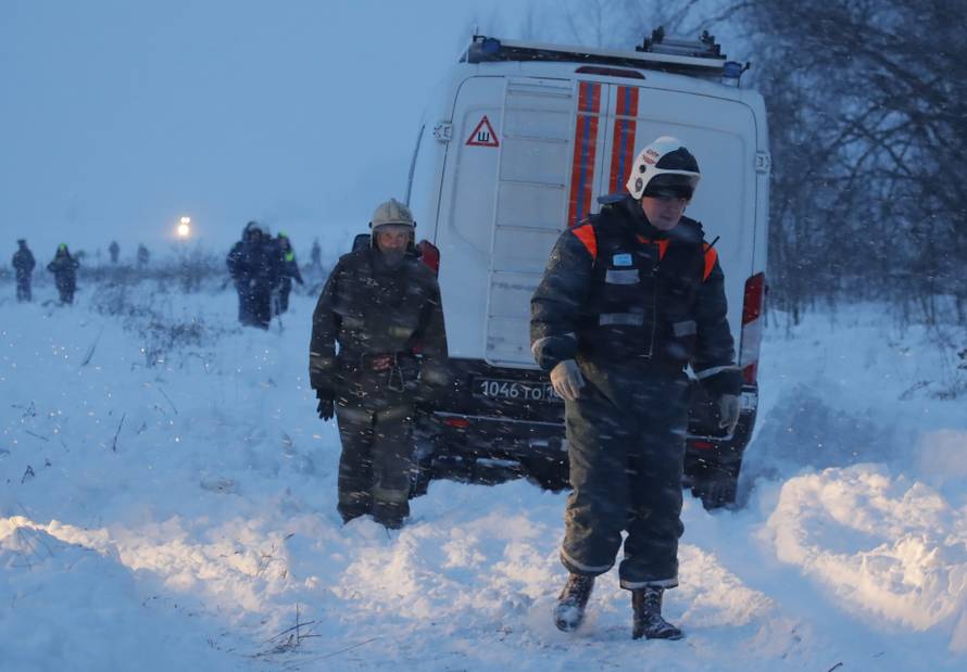 Emergency services work at the scene where a short-haul regional Antonov AN-148 plane crashed after taking off from Moscow's Domodedovo airport, outside Moscow