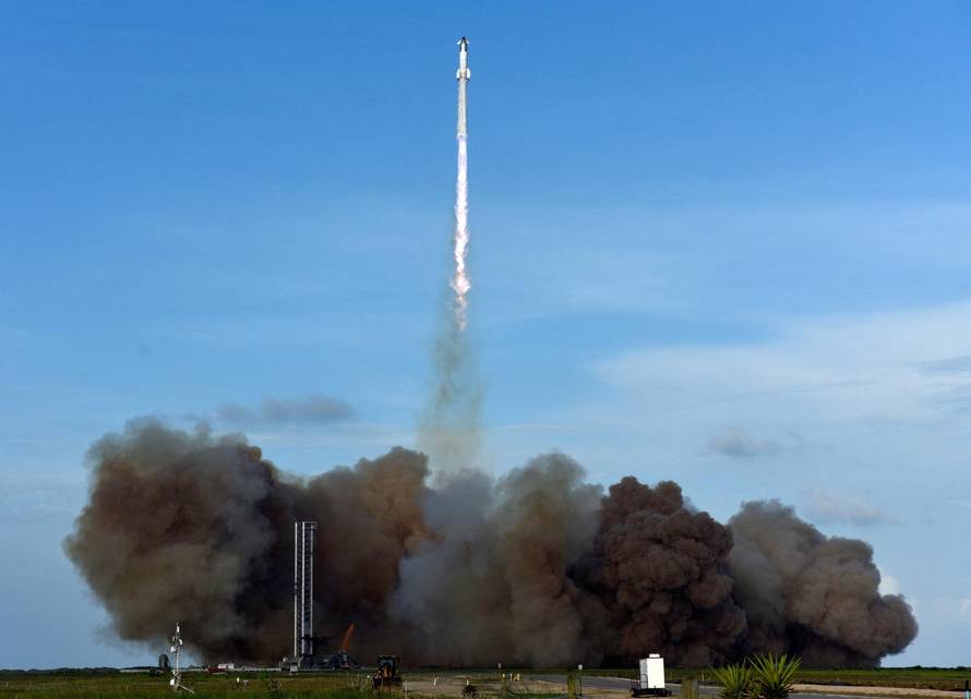 A SpaceX Super Heavy booster carrying the Starship spacecraft lifts off on its 10th test flight
