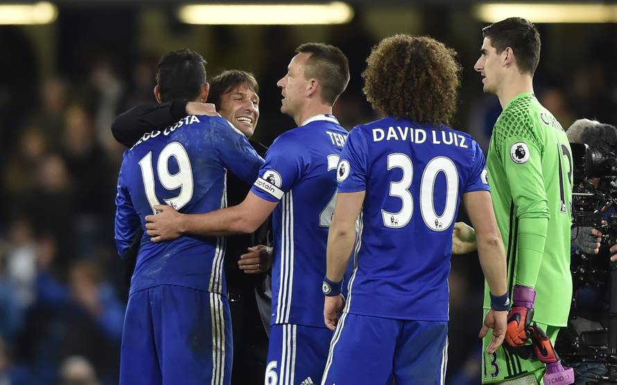 Chelsea's Diego Costa and John Terry celebrate with Chelsea manager Antonio Conte after the match