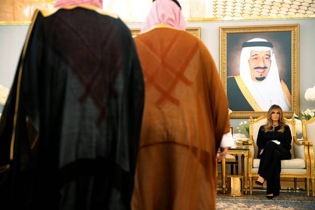 Melania Trump takes her seat next to Saudi Arabia