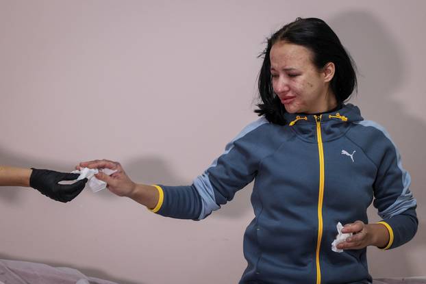 Former Ukrainian service member, who was wounded at a front line, comes to a clinic to treat scars, in Lviv