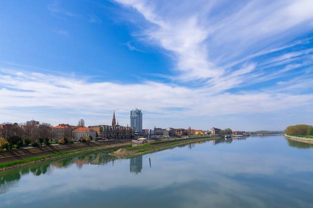 Pedestrian bridge over the Drava river and skyline of city of Osijek, Croatia