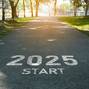 Happy new year, 2025 symbolizes the start of the new year. The letter start new year 2025 on the road in the nature route roadway have tree environment ecology or greenery wallpaper concept.