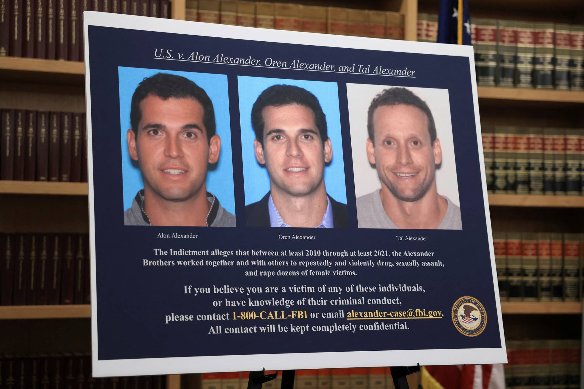 The pictures of the three high profile real estate agent brothers Alon Alexander, Oren Alexander, and Tal Alexander, on charges of sex trafficking and drugs, are displayed at 26 Federal Plaza in New York