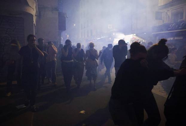 People protest against the French far-right Rassemblement National party, following partial results in the first round of the early 2024 legislative elections, in Paris