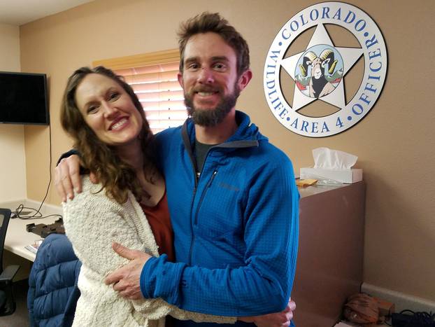FILE PHOTO: Colorado Parks & Wildlife photo of Travis Kauffman and Annie Bierbouer in Fort Collins, Colorado