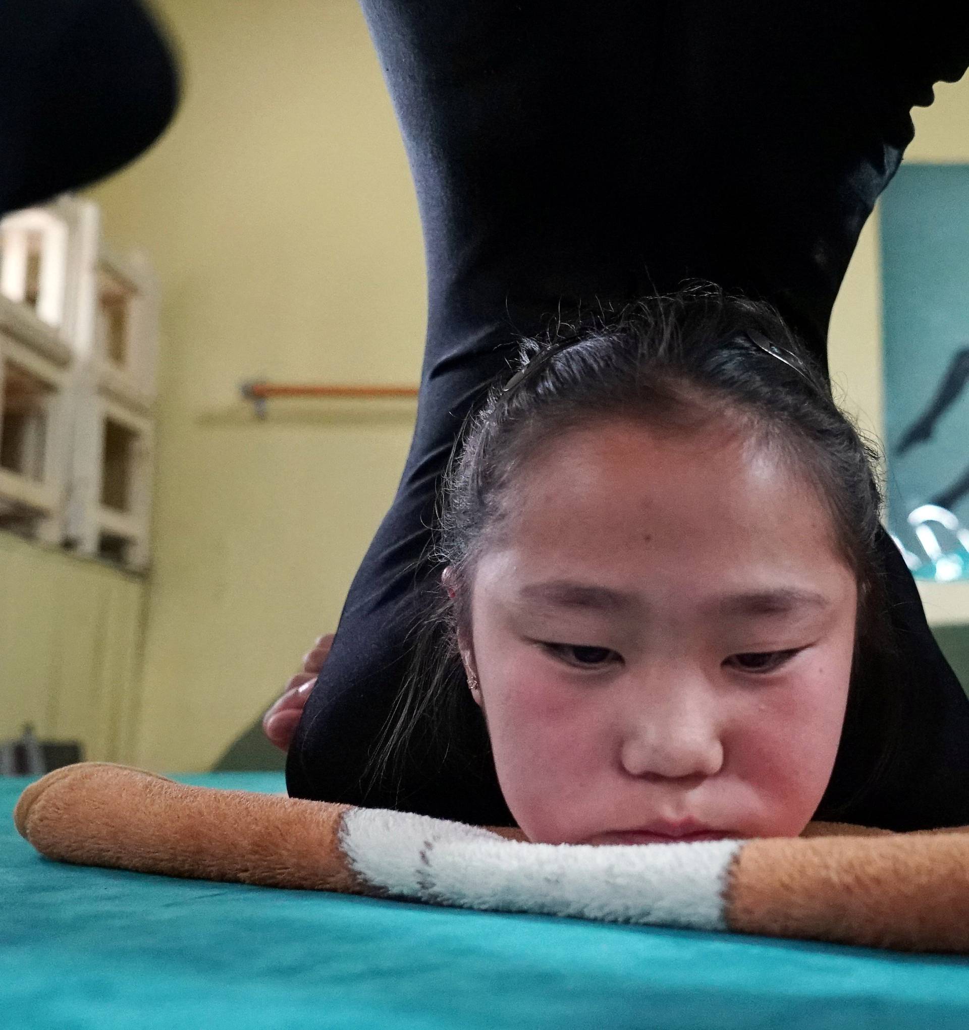 A young contortionist practices at a training school in Ulaanbaatar