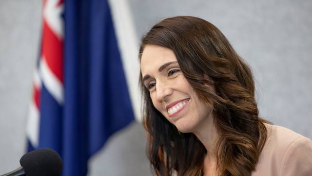 New Zealand Prime Minister Jacinda Ardern smiles during a news conference prior to the anniversary of the mosque attacks that took place the prior year in Christchurch