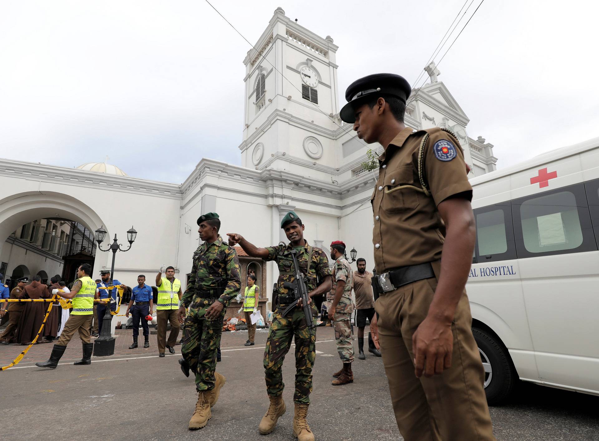 Sri Lankan military officials stand guard in front of the St. Anthony's Shrine, Kochchikade church after an explosion in Colombo