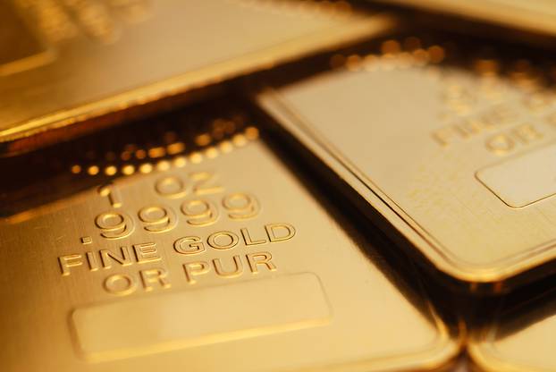 Extreme close-up of shiny gold ingots