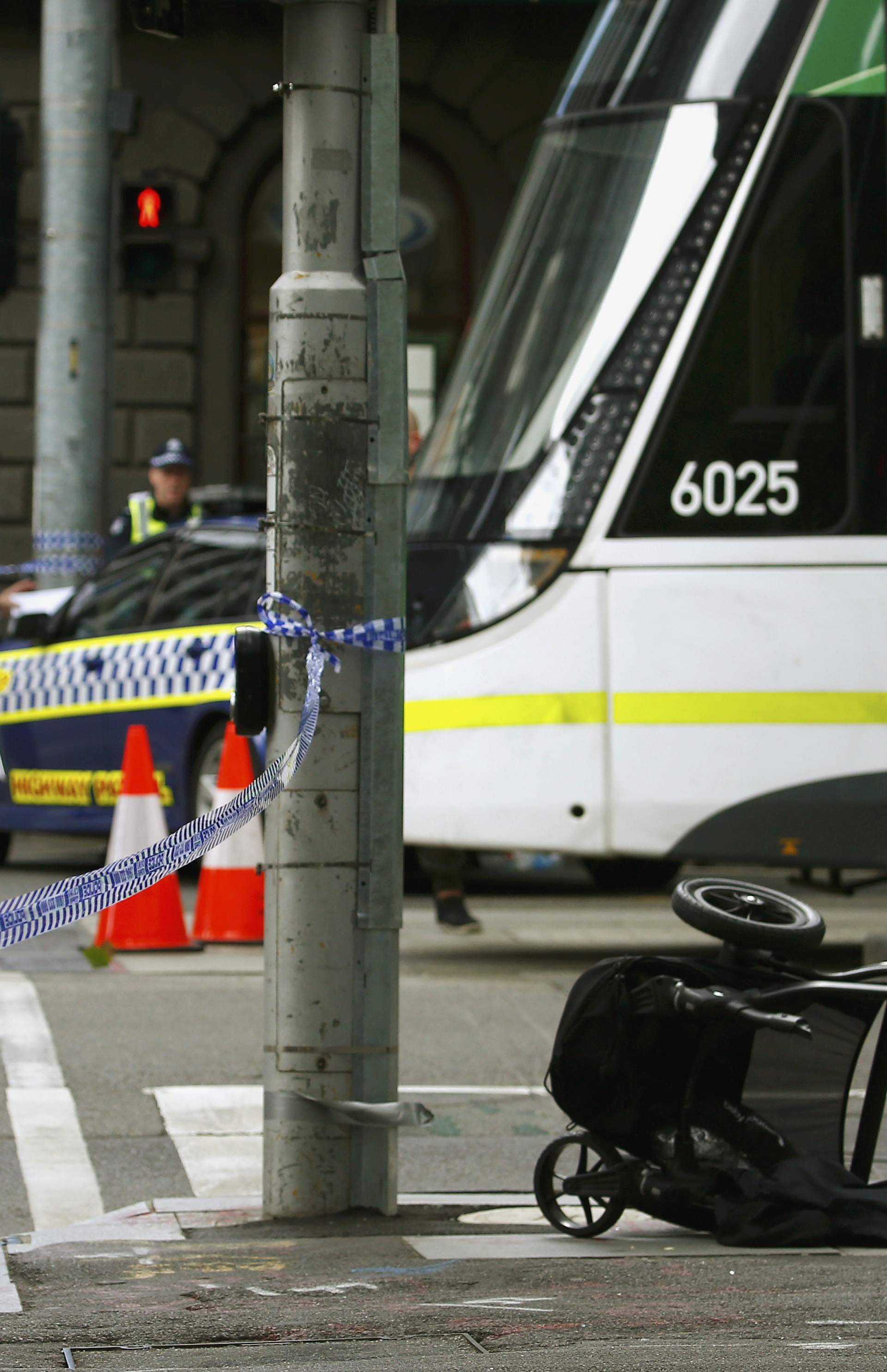 A pram is seen as police cordon off Bourke Street mall, after a car hit pedestrians in central Melbourne