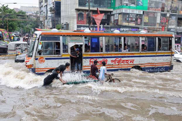 Torrential rain flooded the streets of Dhaka