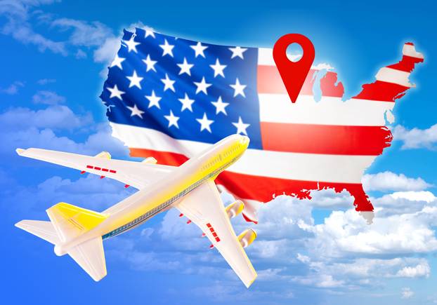 Flight to USA. Plane of United States of America. American airlines. Concept for plane ticket to USA. USA map in colors of flag on background of sky. Air travel in America. Air ticket to US