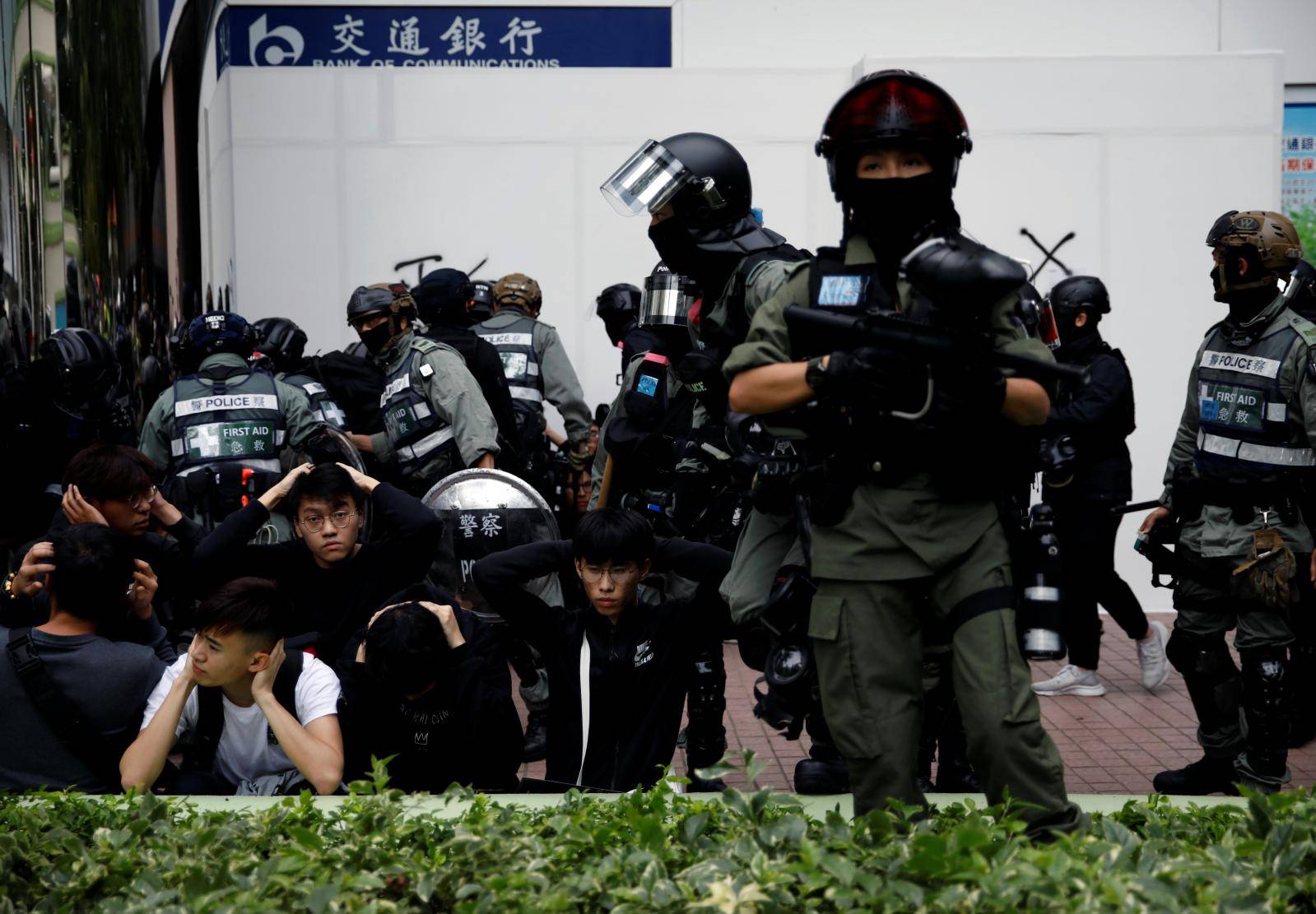 Police detain anti-government protesters after an anti-parallel trading protest at Sheung Shui, a border town in Hong Kong