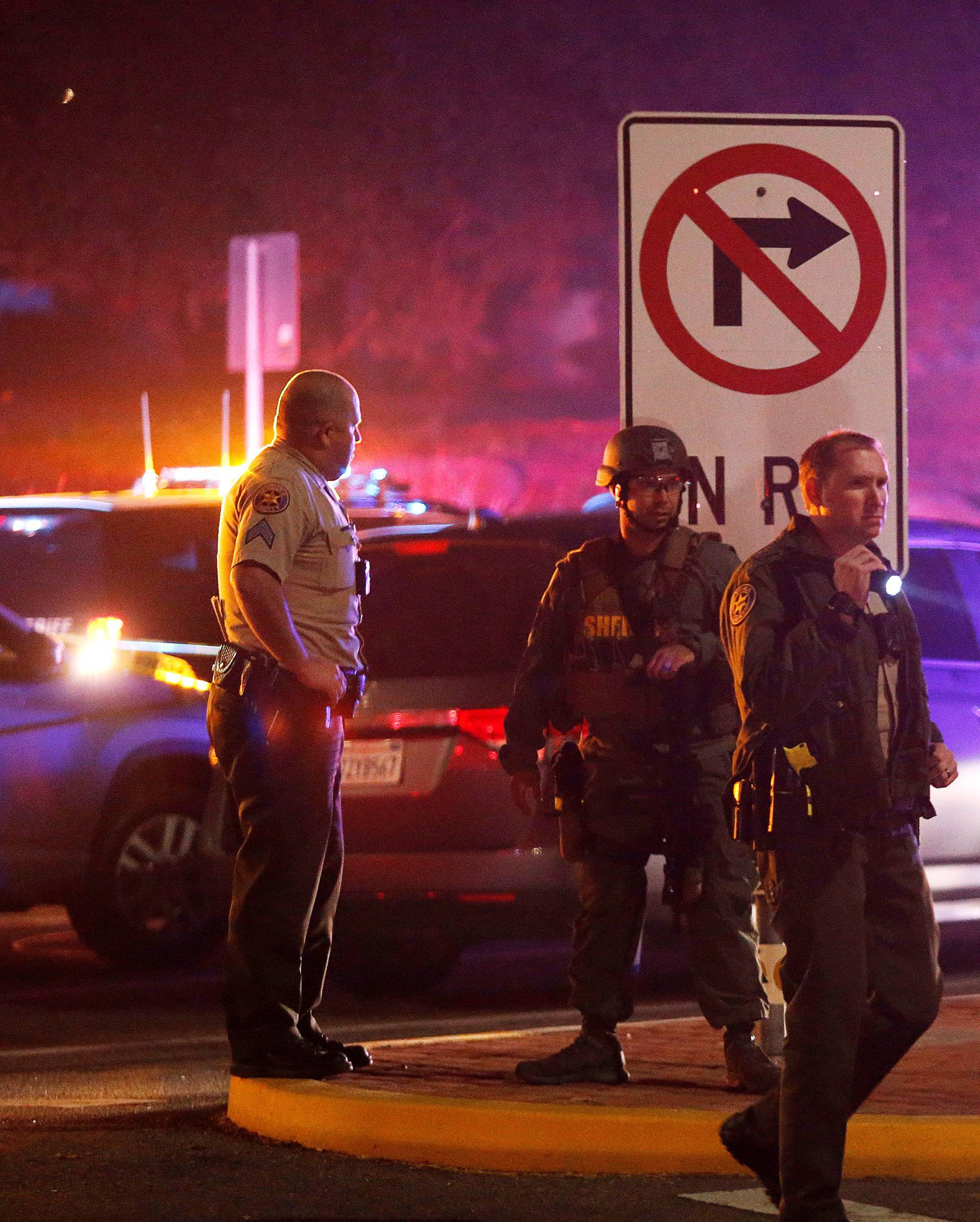 Police guard the site of a mass shooting at a bar in Thousand Oaks