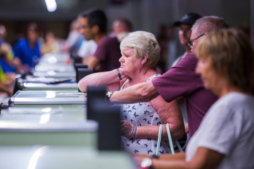 Thomas Cook passengers are seen at Las Palmas Airport after the world's oldest travel firm collapsed