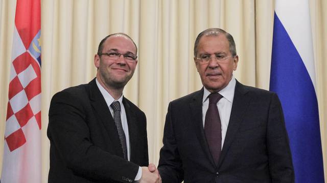 Russian Foreign Minister Sergei Lavrov shakes hands with Croatian Minister of Foreign and European Affairs Davor Ivo Stier during a joint news conference following their meeting in Moscow
