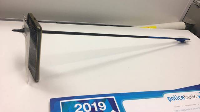 A picture shows an arrow that pierced a mobile telephone after accident in Nimbin