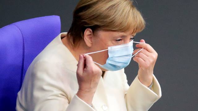 German Chancellor Angela Merkel attends a session of the Bundestag, in Berlin