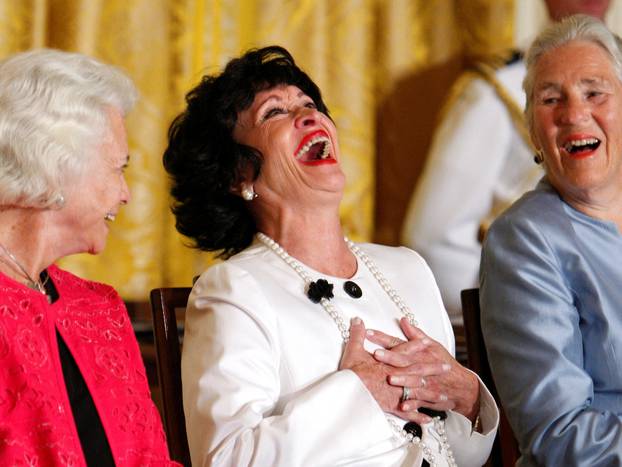 FILE PHOTO: Medal of Freedom recipients laugh during a ceremony in Washington