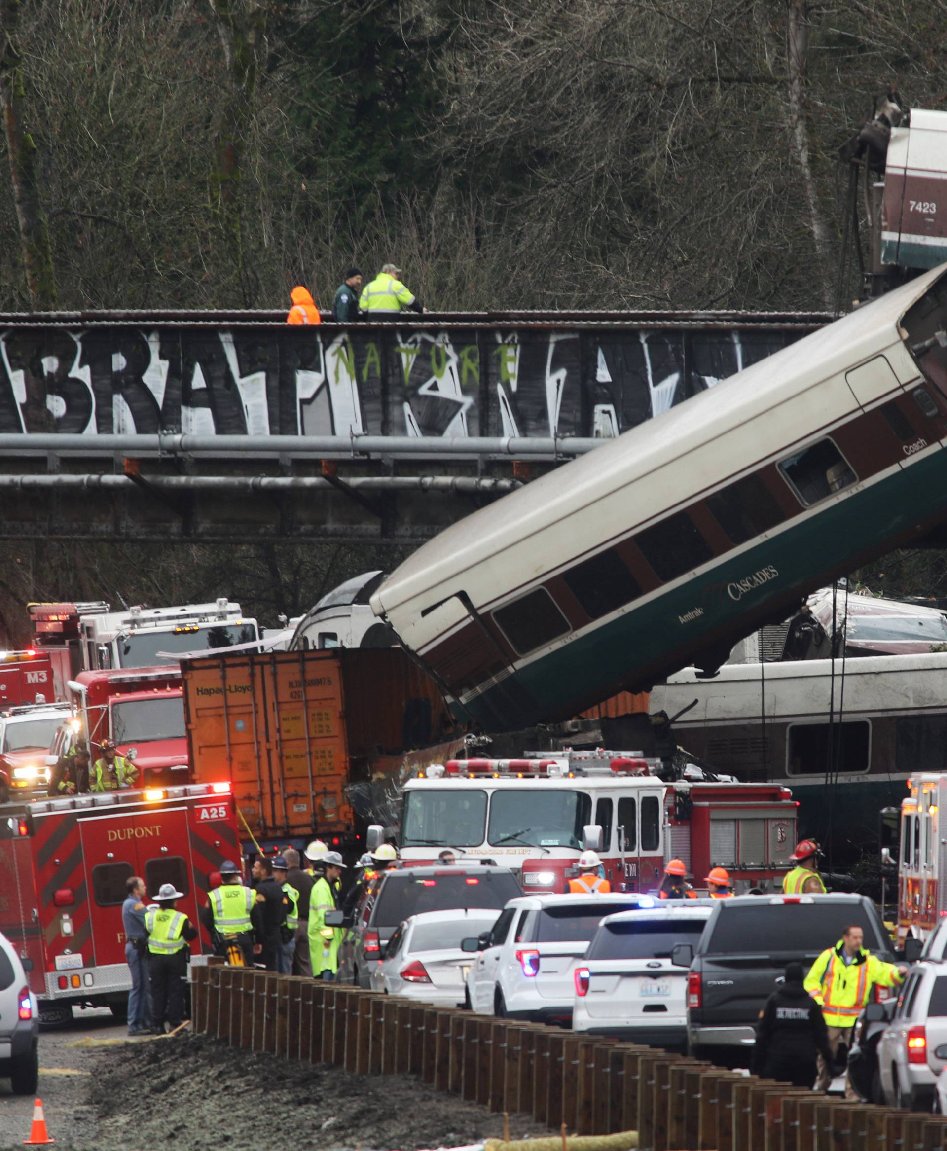 First responders are at the scene of an Amtrak passenger train which derailed and is hanging from a bridge over the I-5 in DuPont