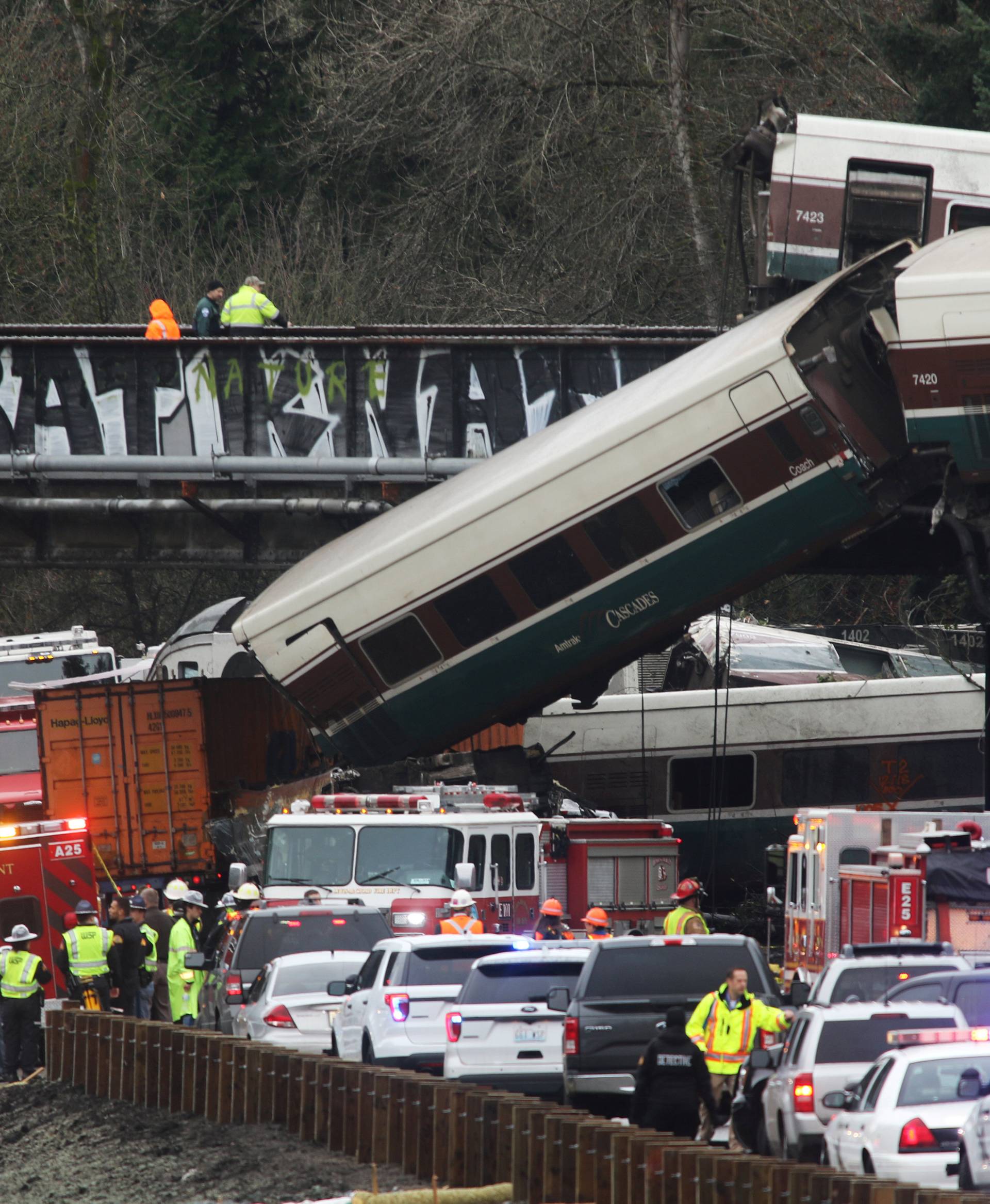 First responders are at the scene of an Amtrak passenger train which derailed and is hanging from a bridge over the I-5 in DuPont